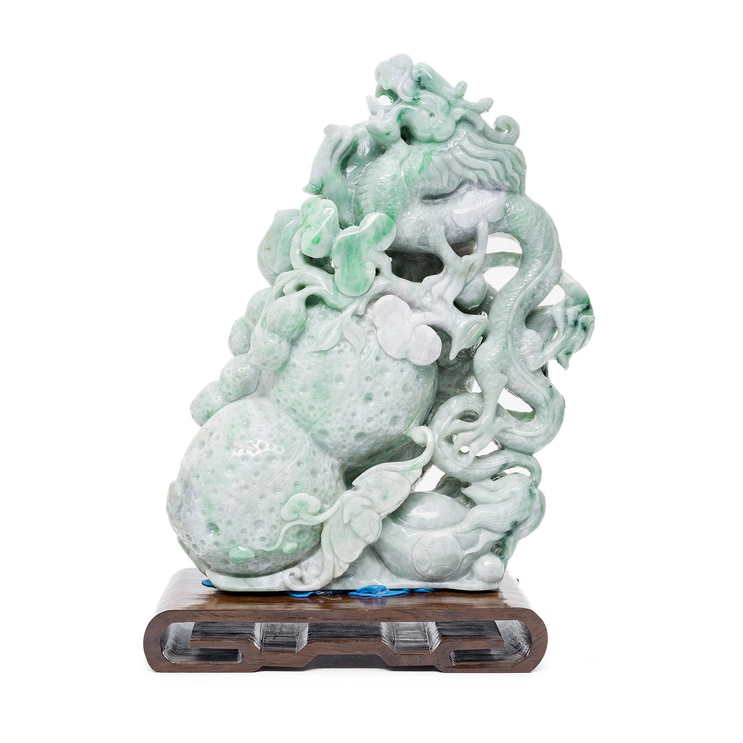 Hand-carved jade dragon sculpture in pale and apple green