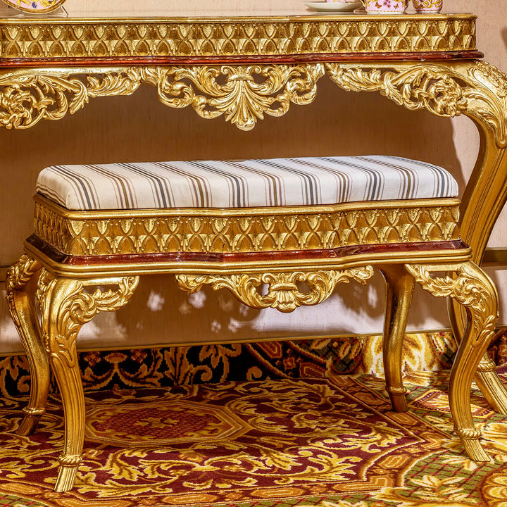 Timeless European vanity with a gold-accented bench.