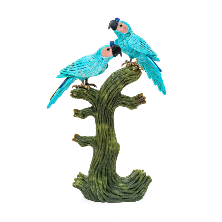 Hand-carved turquoise parrot sculpture on tree.