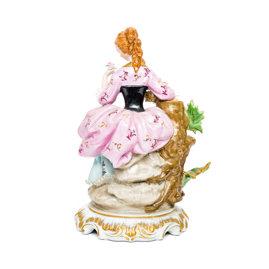 Hand-painted floral details on Dresden Porcelain Flower Lady figurine.