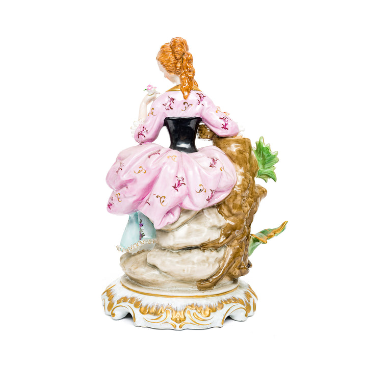 Hand-painted floral details on Dresden Porcelain Flower Lady figurine.