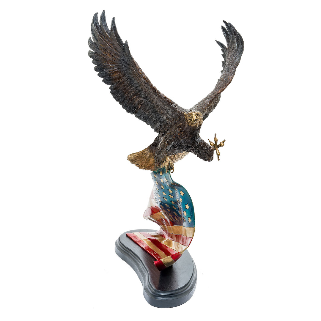 Majestic bald eagle sculpture gripping the U.S. flag