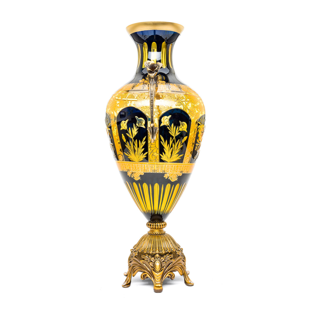 Handcrafted crystal vase with rich blue color and luxurious gold and bronze.