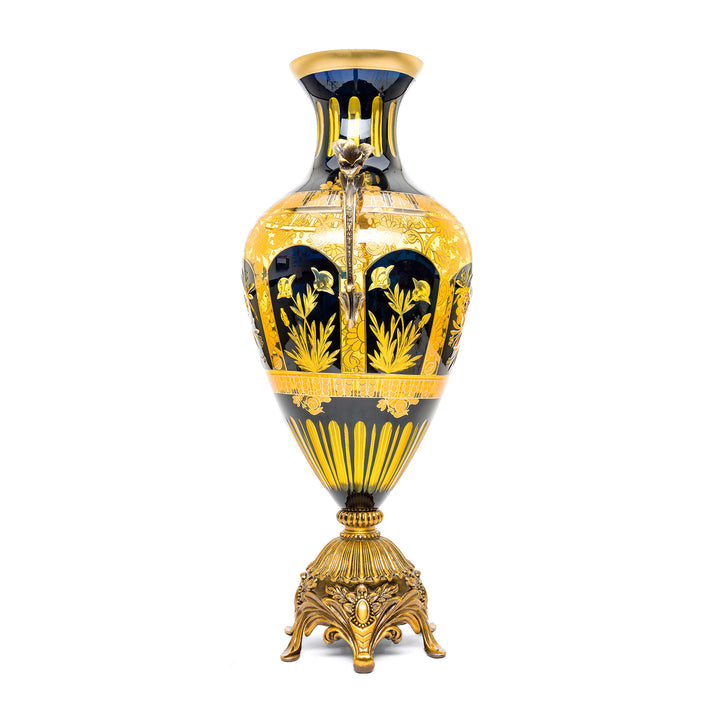 Handcrafted crystal vase with rich blue color and luxurious gold and bronze.