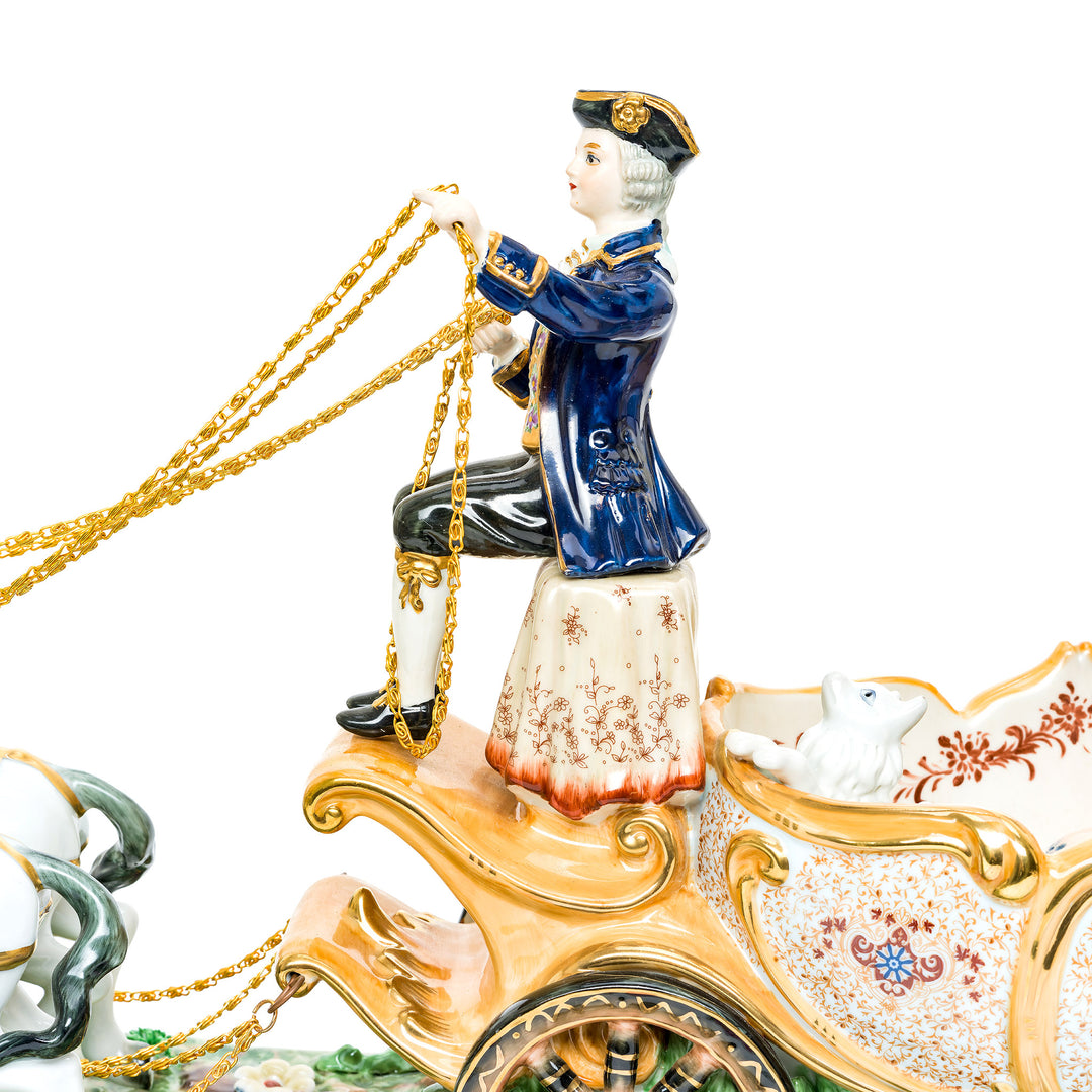 Handcrafted porcelain carriage adorned with floral motifs and gold details.
