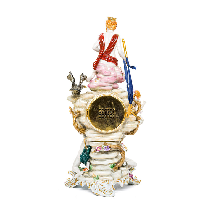 Handcrafted porcelain mantle clock with cherubs and an eagle.