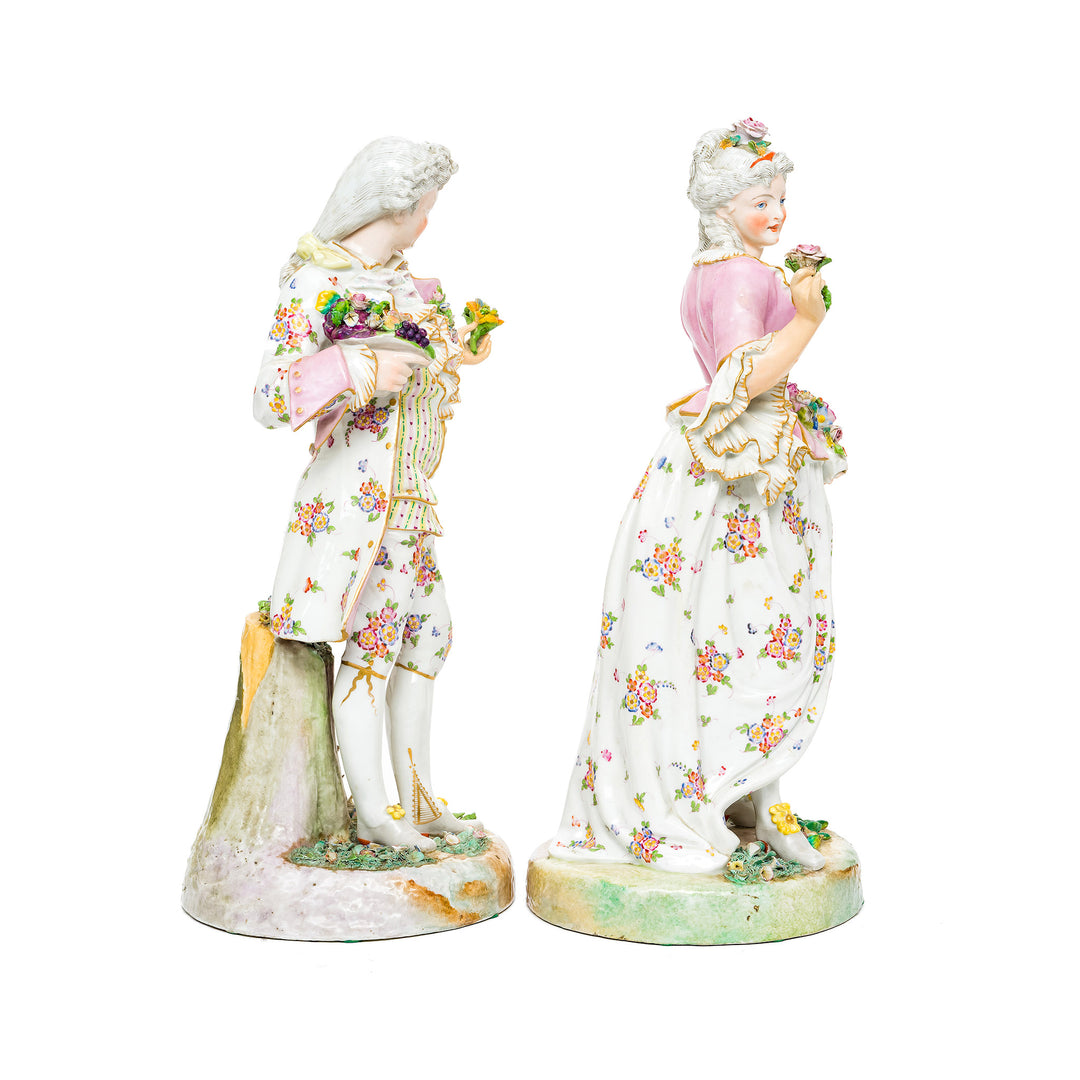 Intricate floral patterns on Rococo courtiers' attire in porcelain.
