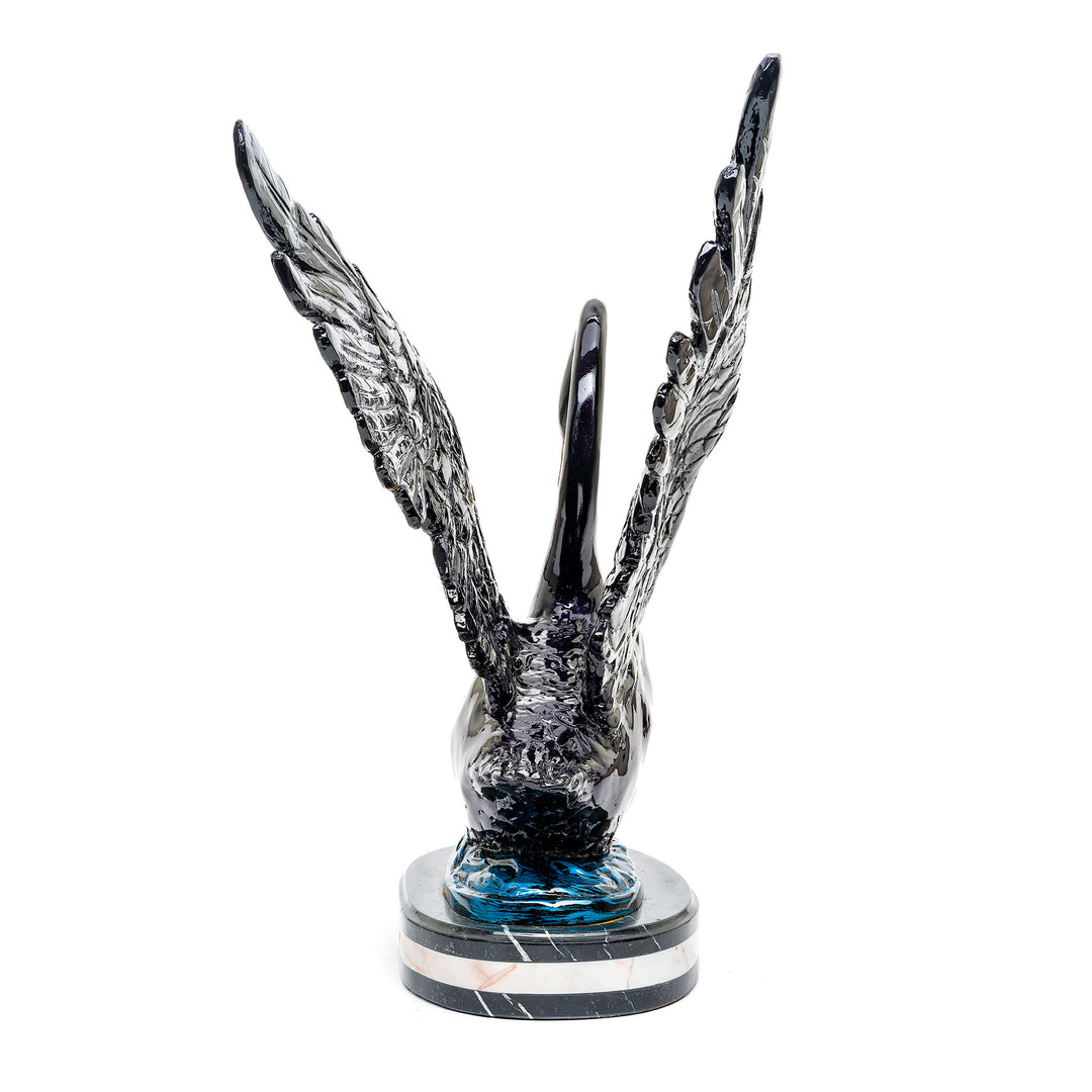 Luxurious bronze swan sculpture with detailed feathers and glossy finish.