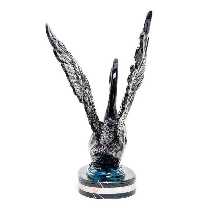 Luxurious bronze swan sculpture with detailed feathers and glossy finish.