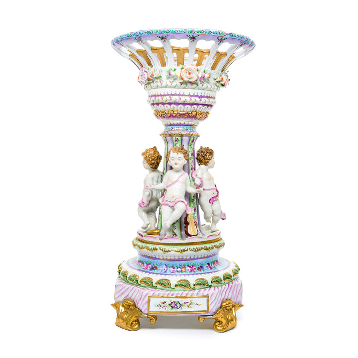 Luxurious handmade porcelain decor with musical cherubs.