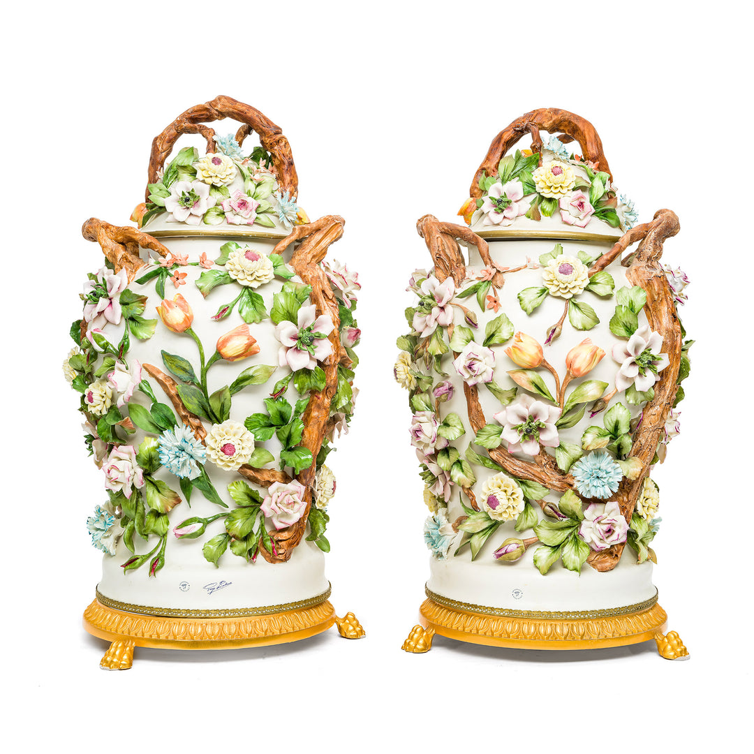 Luxurious porcelain vases with vibrant floral designs by Capodimonte.