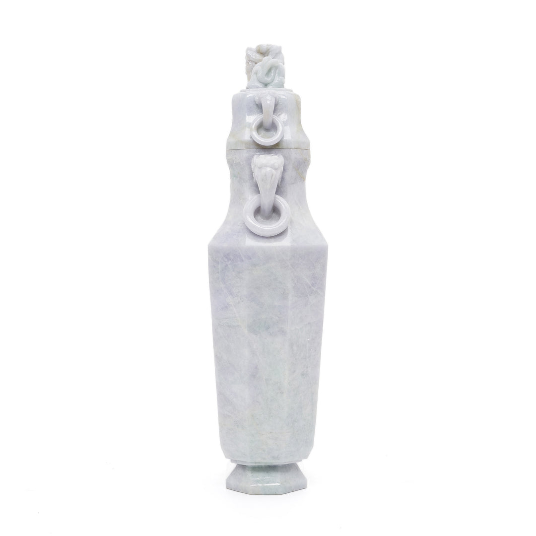 Exquisite jade vase featuring a sculpted Foo Dog lid