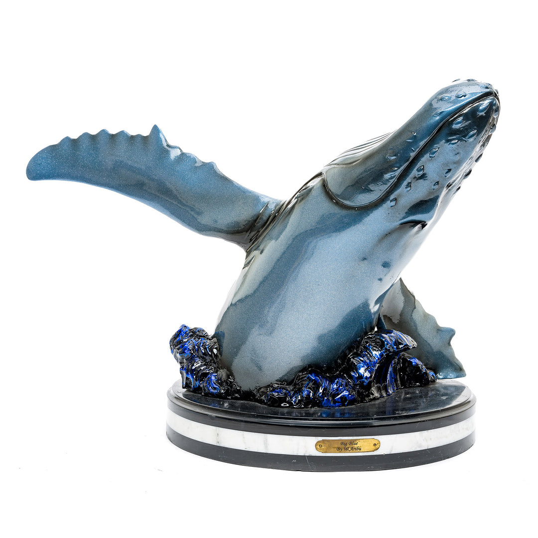 Majestic bronze whale sculpture by Muzika with custom blue patina.