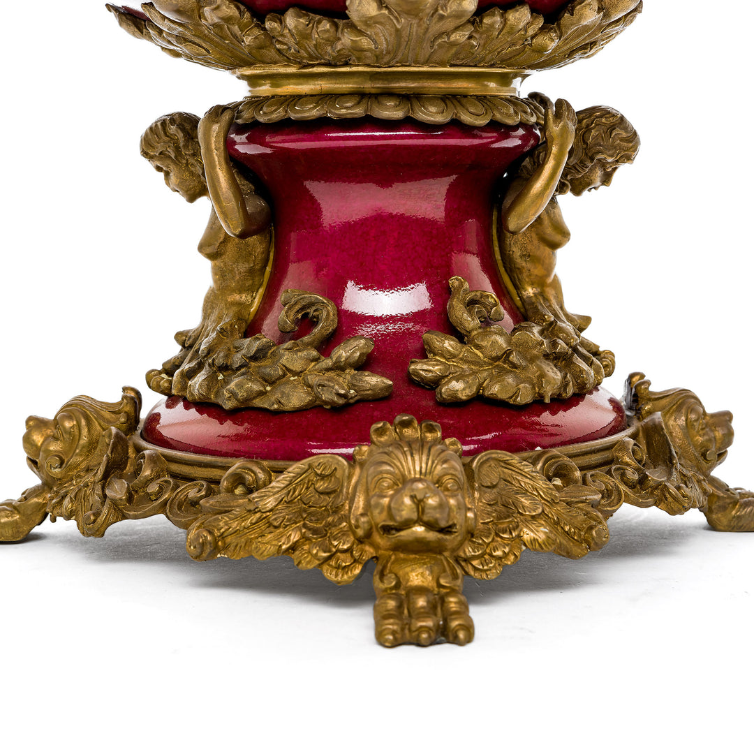Majestic red bowl with ornate gold detailing and horse figures.