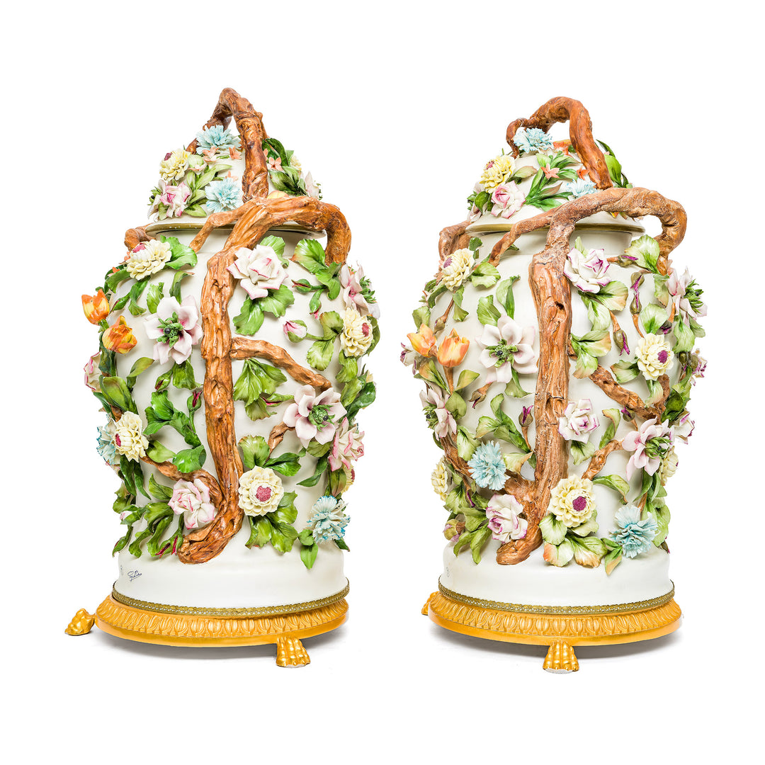 Pair of Capodimonte vases with hand-sculpted flowers and gold base.