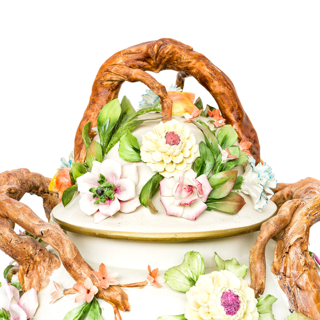 Pair of floral Capodimonte vases with intricate detailing and gold accents.