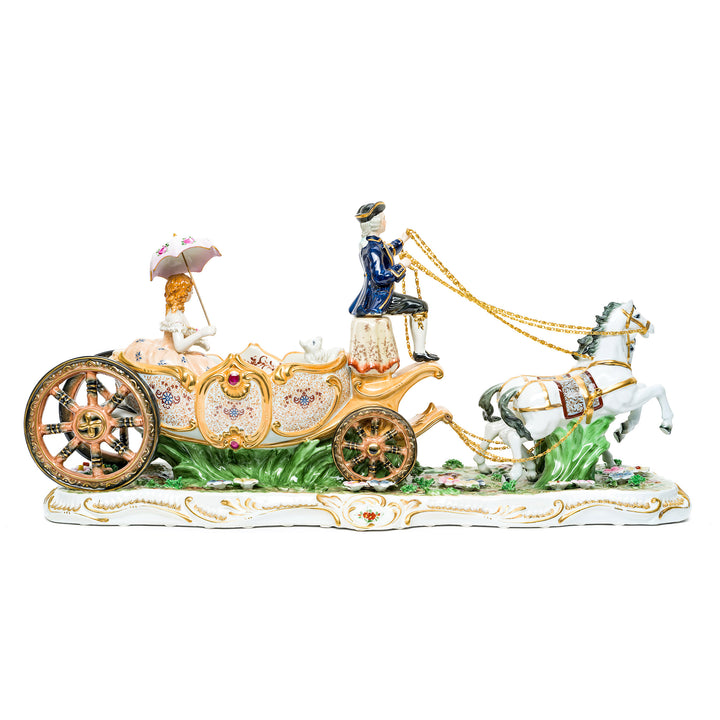 Regal porcelain carriage with gilded accents and delicate floral patterns.