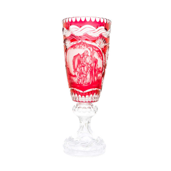 Ruby red crystal vase with intricate hand-cut design.