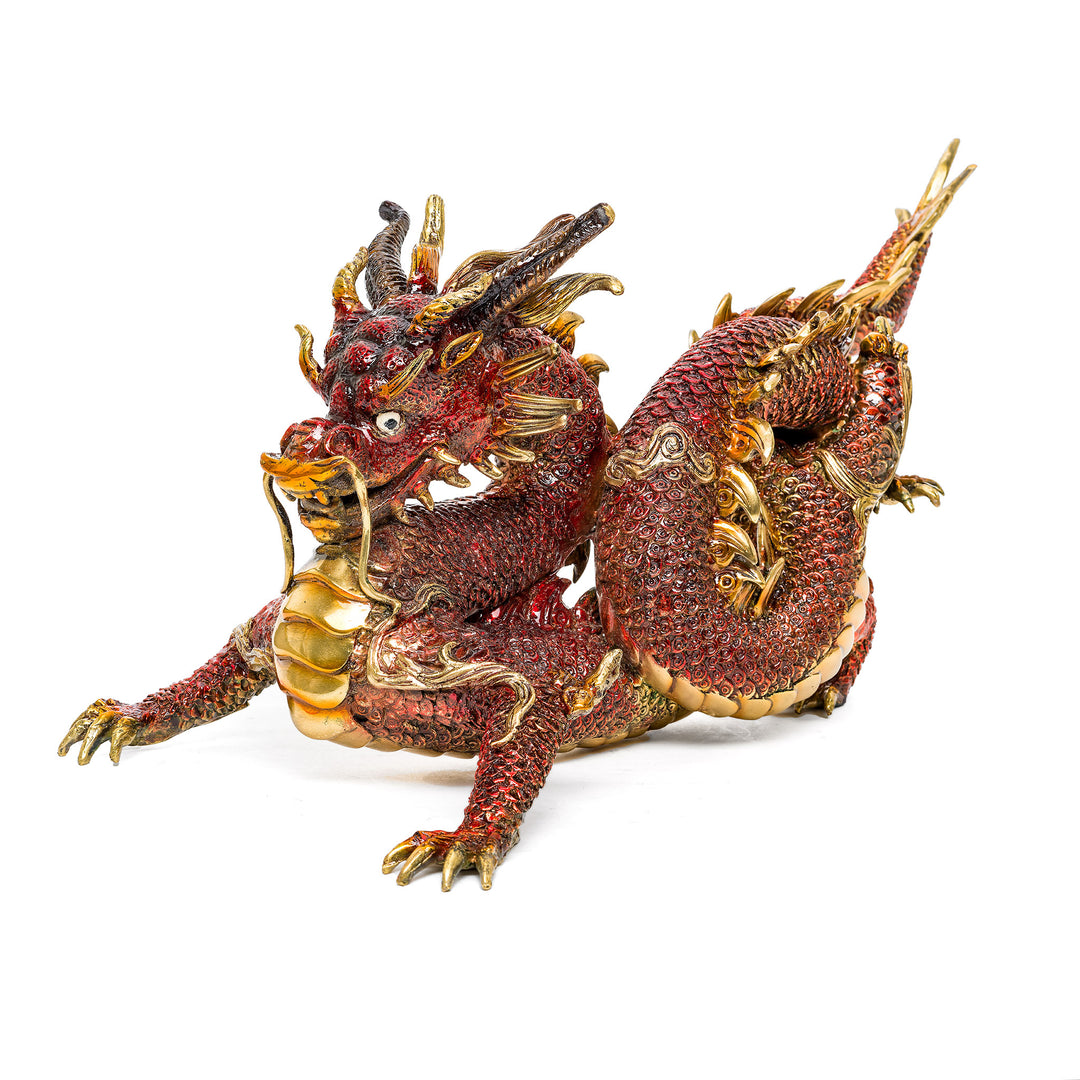 Striking red bronze dragon sculpture with intricate detailing.