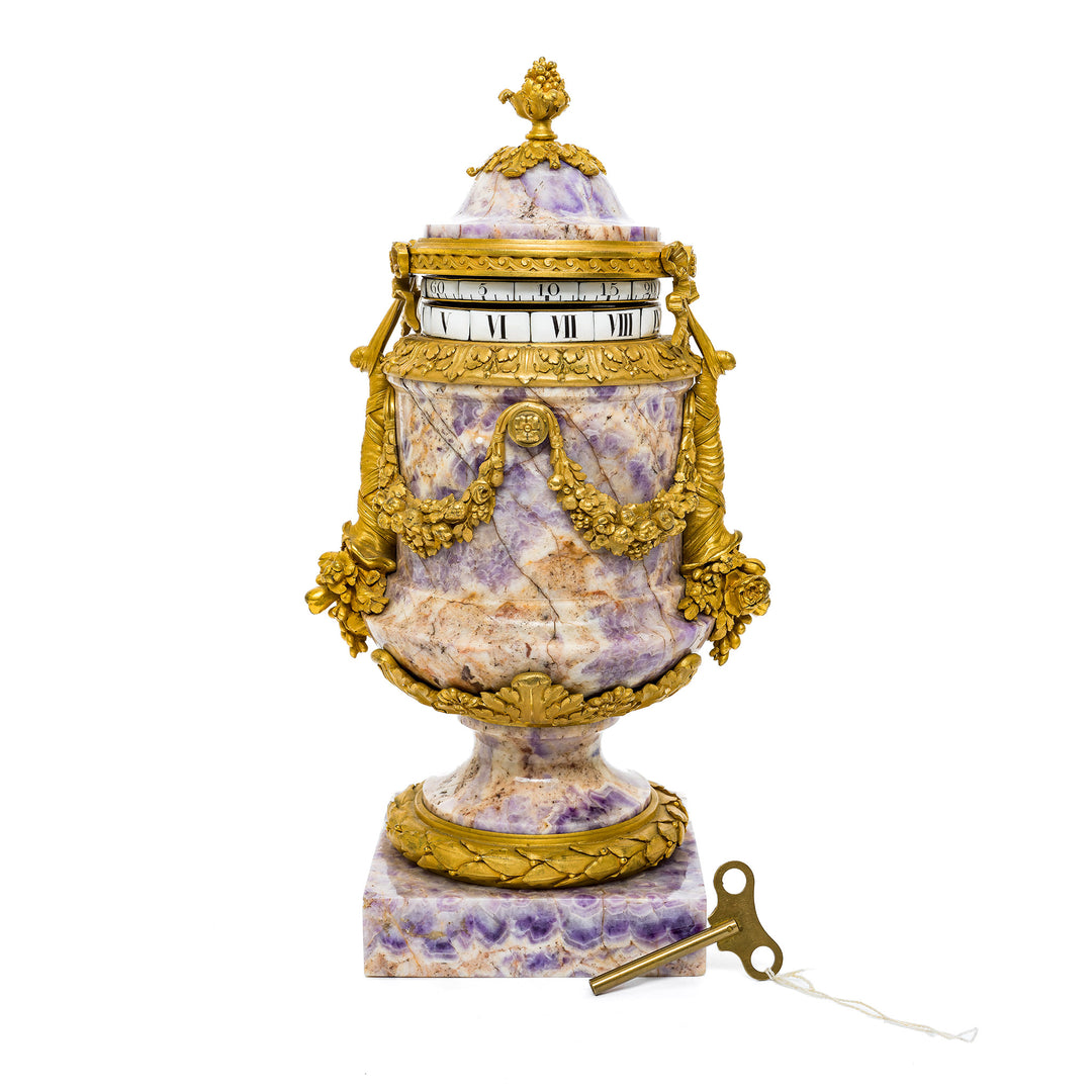 Antique French amethyst clock with gilt bronze mounts and Roman numeral face.