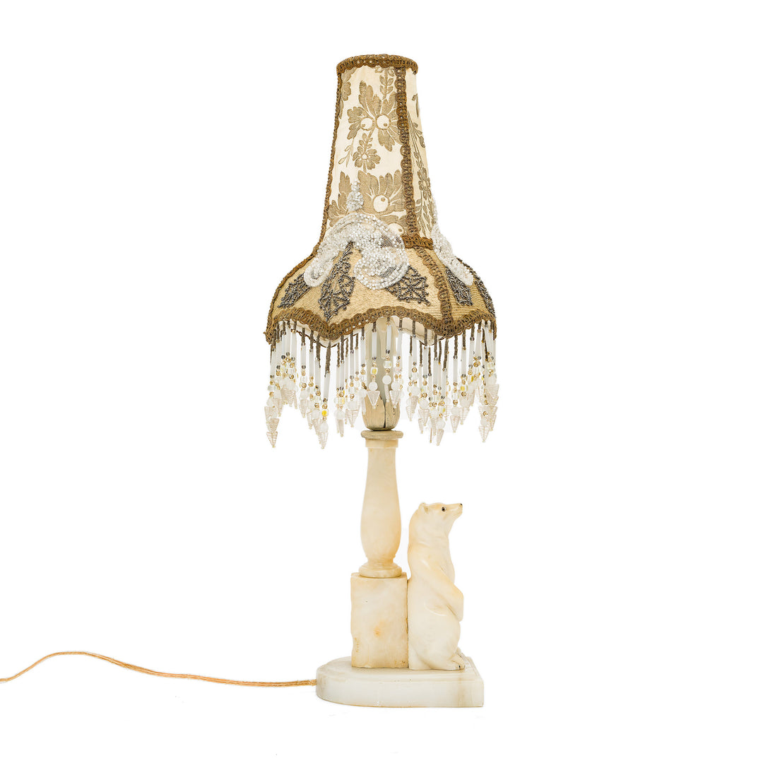 Antique-style lamp with carved polar bear base