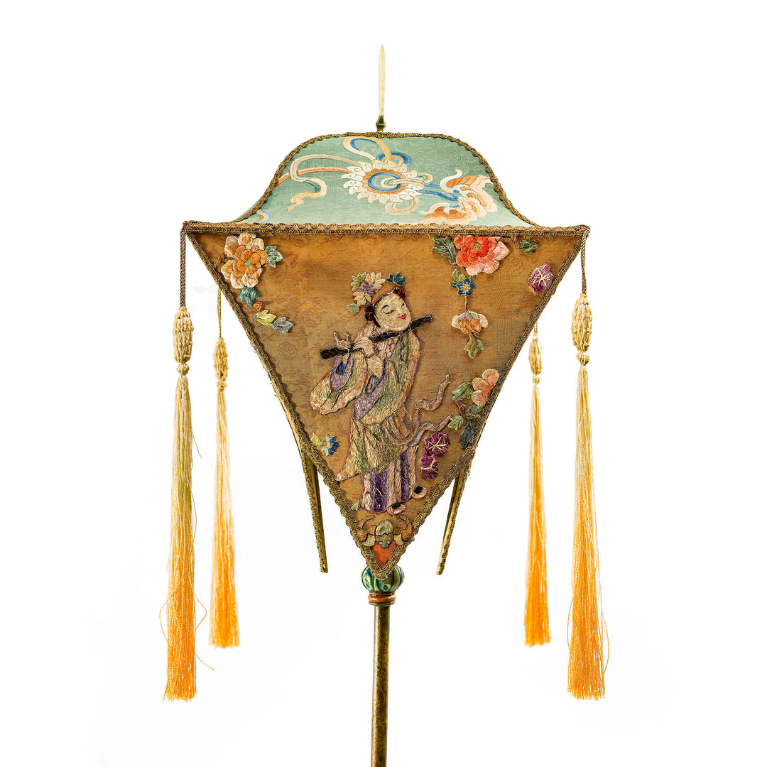 Antique tall floor lamp with richly embroidered traditional figures