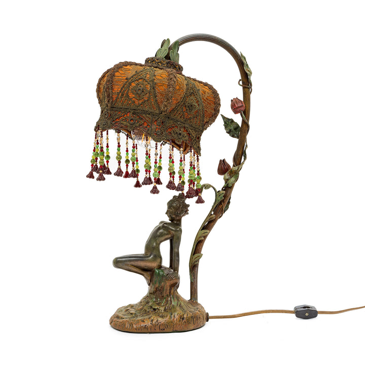 Art Nouveau bronze lady lamp with floral detailing