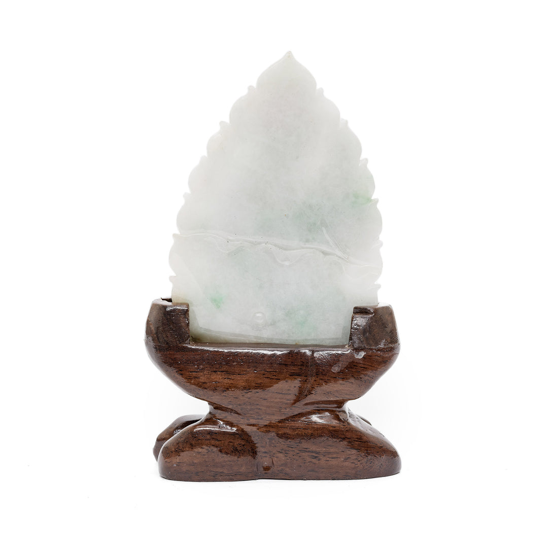 Back of Guan Yin jade sculpture on wooden base
