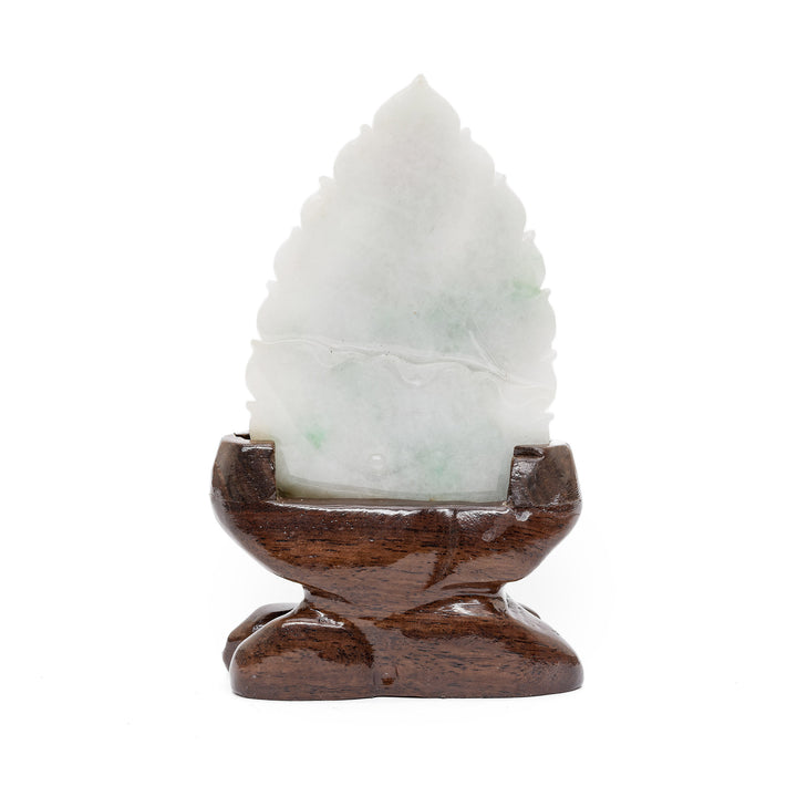 Back of Guan Yin jade sculpture on wooden base