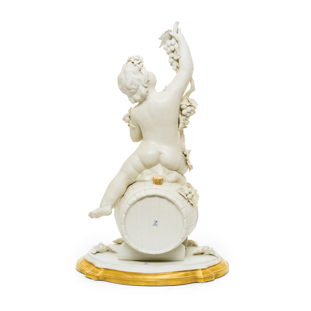 Back view of Capodimonte porcelain cherub on a barrel with golden base