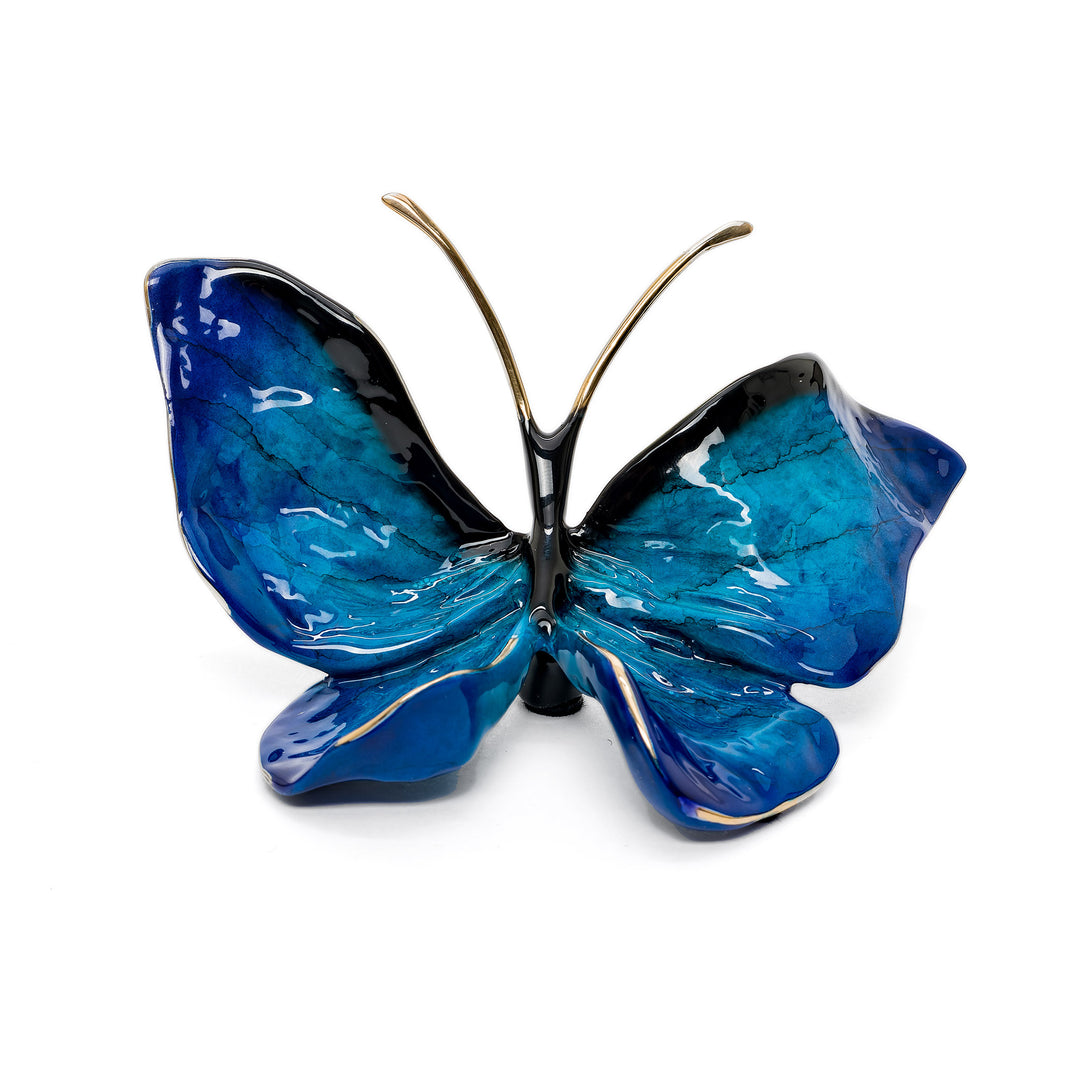 Glossy blue bronze butterfly sculpture with black accents