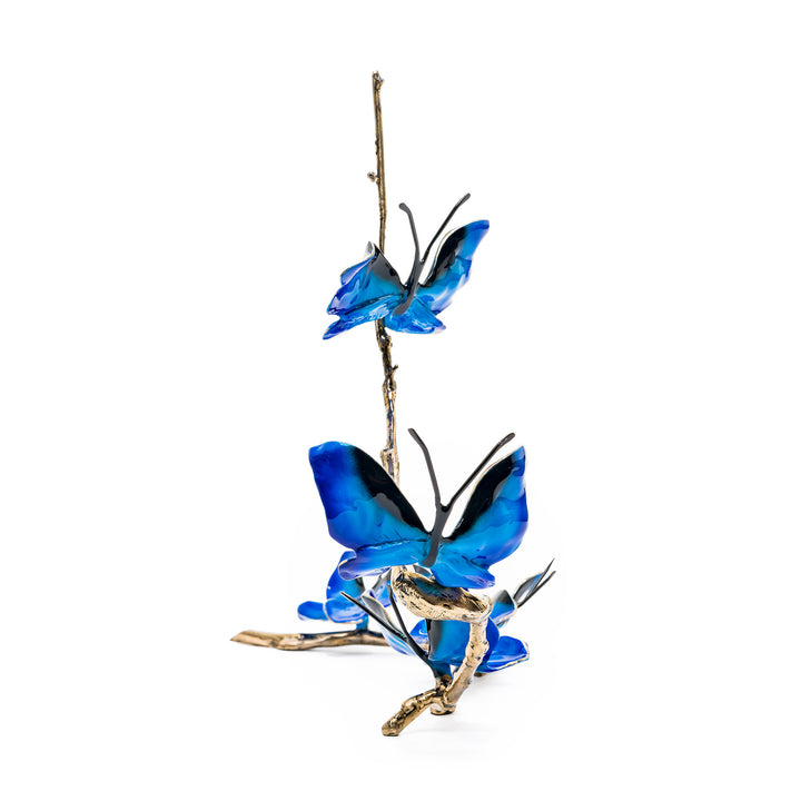 Side angle showing vertical butterfly flight on golden branch