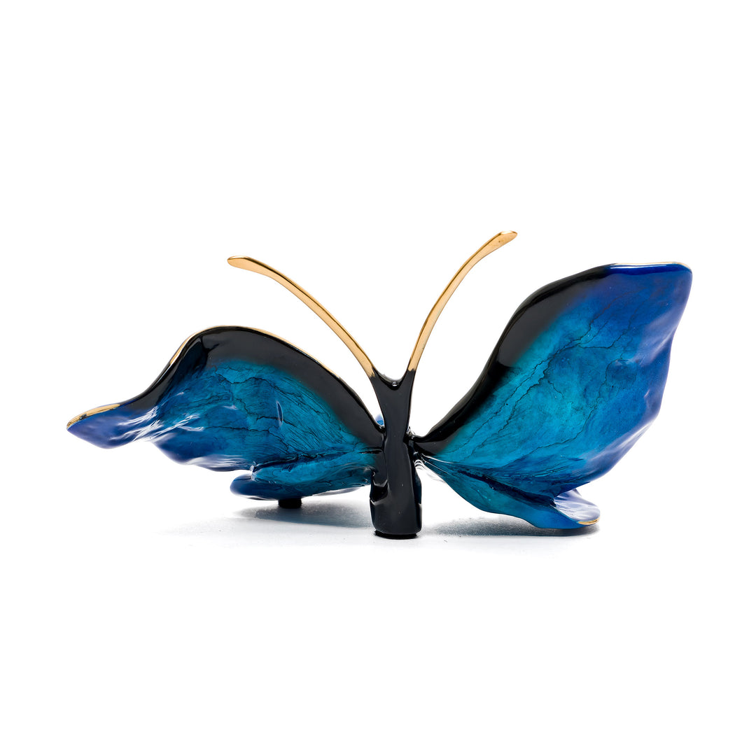 Blue butterfly art sculpture with lifelike bronze form