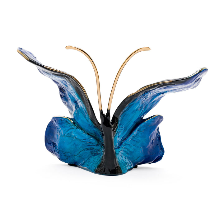 Rear angle of bronze butterfly with flowing wing design
