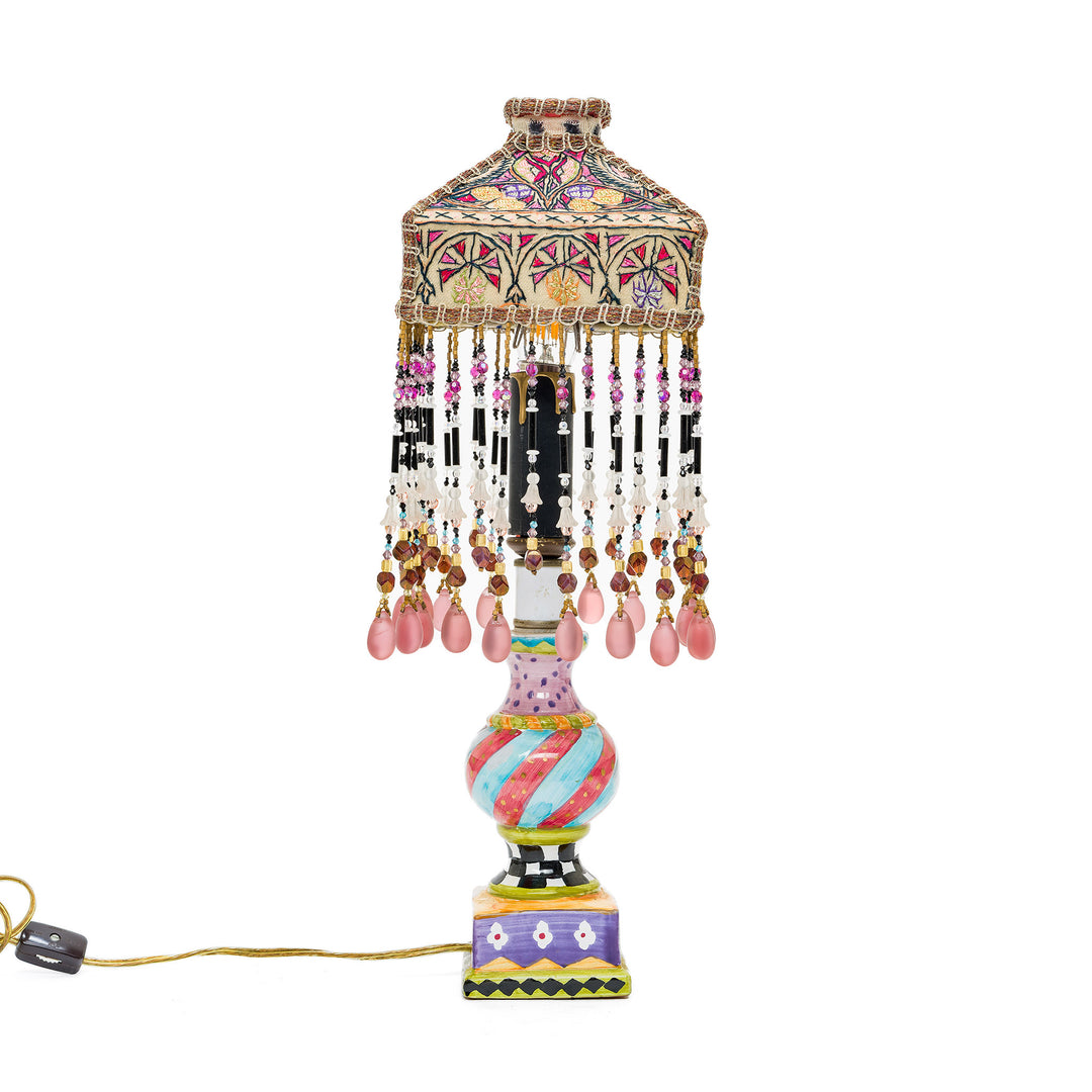 Bohemian-style decorative lamp with pink and gold beaded accents