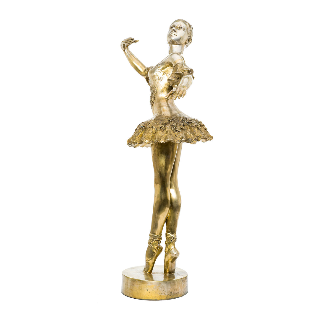 Bronze ballerina sculpture on pointe with elegant poise.