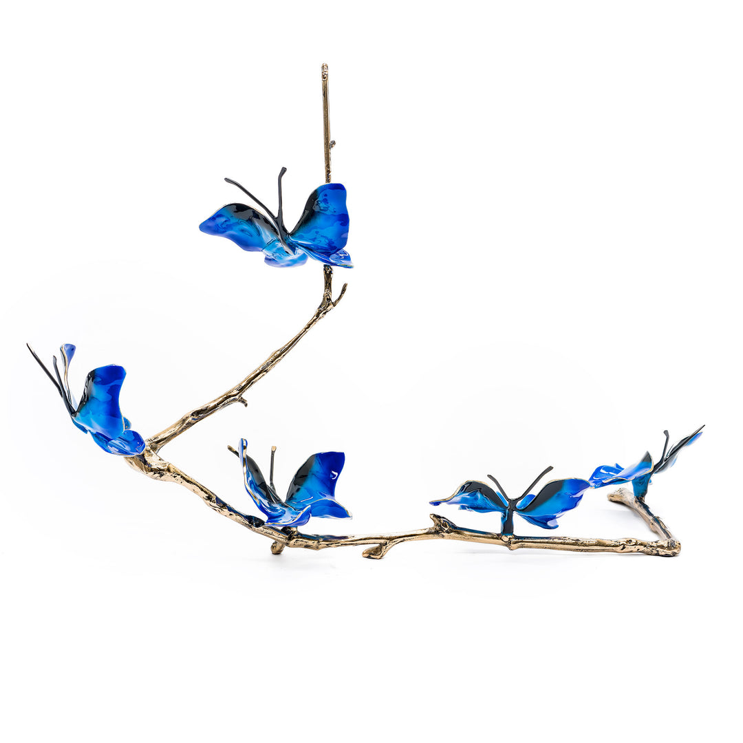 Rear view of cobalt butterflies on sculpted bronze branch