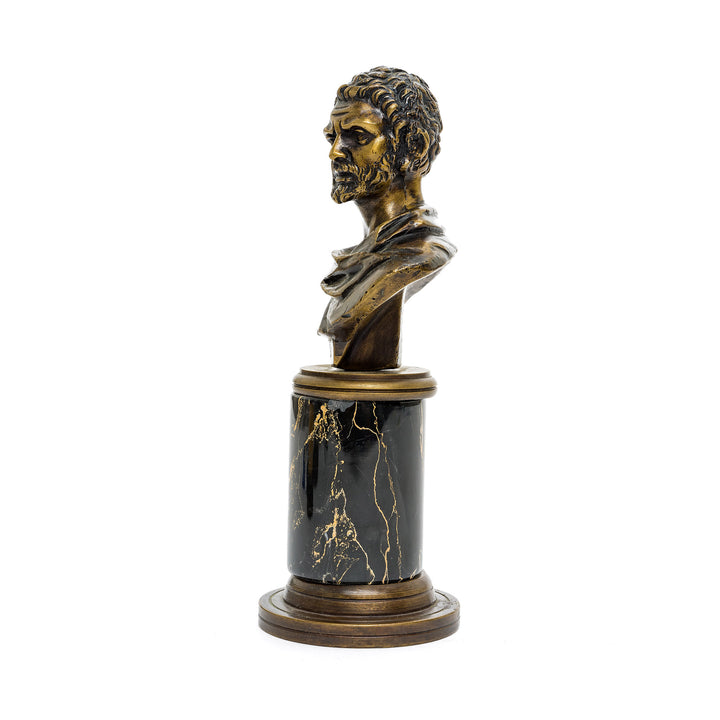 Bronze bust of Caracalla with dark marble base and golden veining.