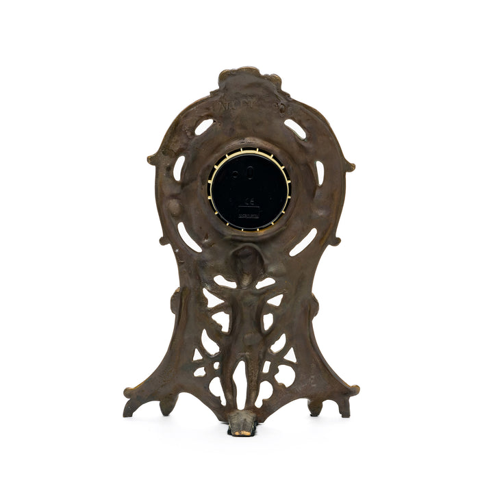 Back view of antique-style bronze clock housing