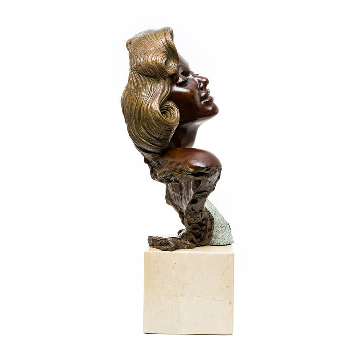 Bronze bust with patina crescent mounted on marble plinth