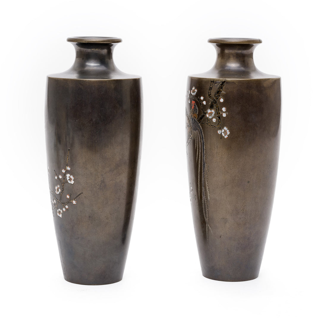 Side view showcasing cherry blossom inlay on bronze vases