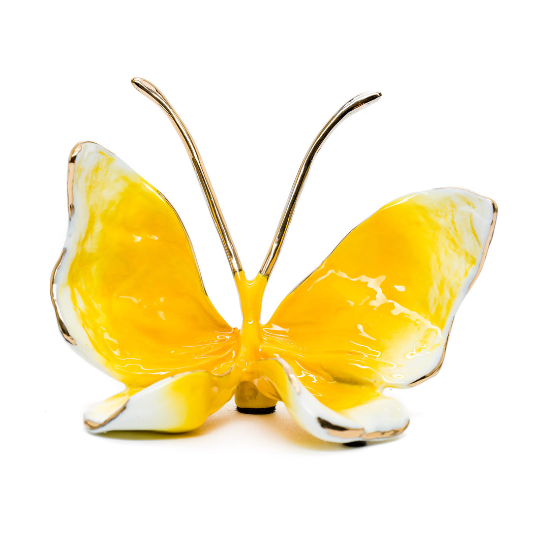 Yellow and white bronze butterfly sculpture with glossy finish