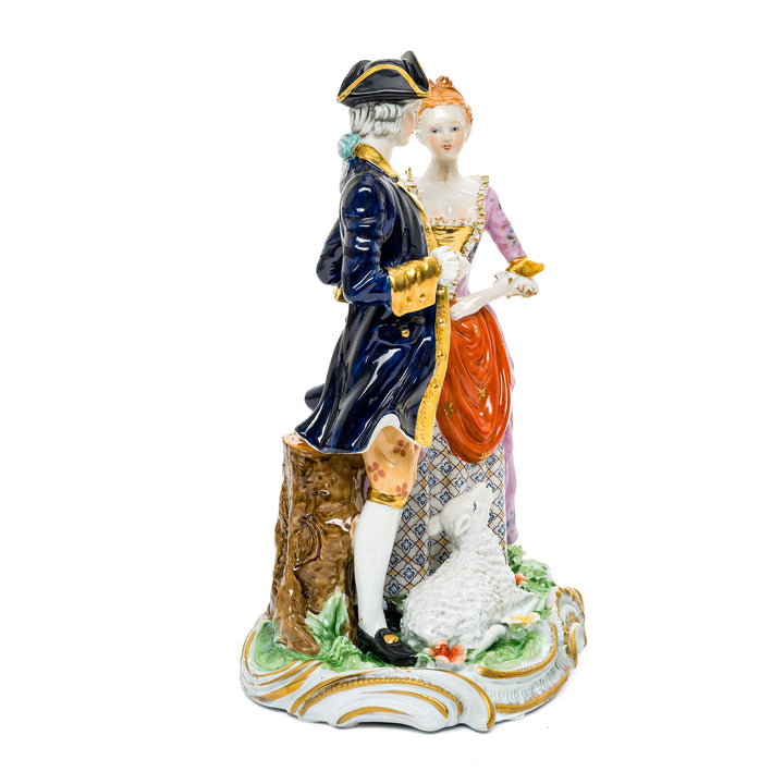 Charming courtship figurine made from fine German porcelain, depicting a colonial couple and lamb.