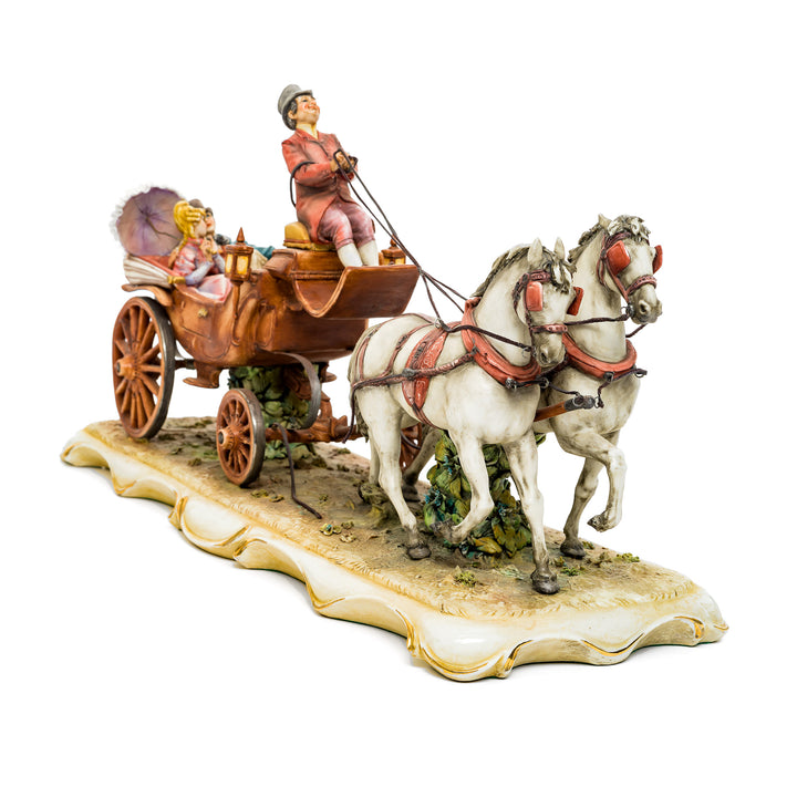 Classic horse carriage porcelain sculpture with rich details and 18th-century attire.