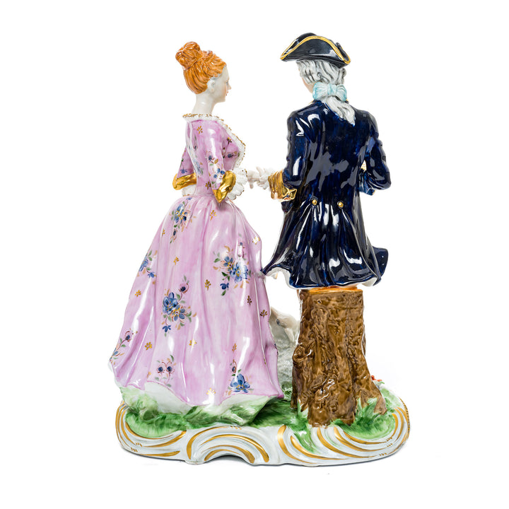 Colonial couple with lamb, detailed German porcelain figurine with vibrant colors.