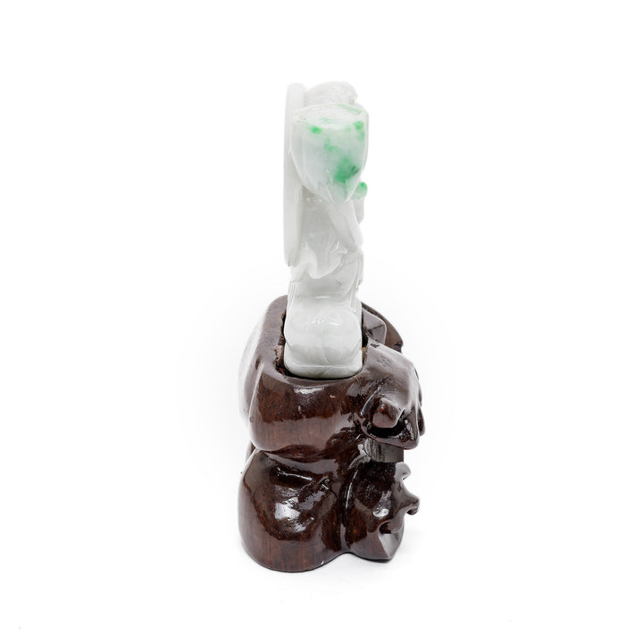 Compact jade deity sculpture with flower motif