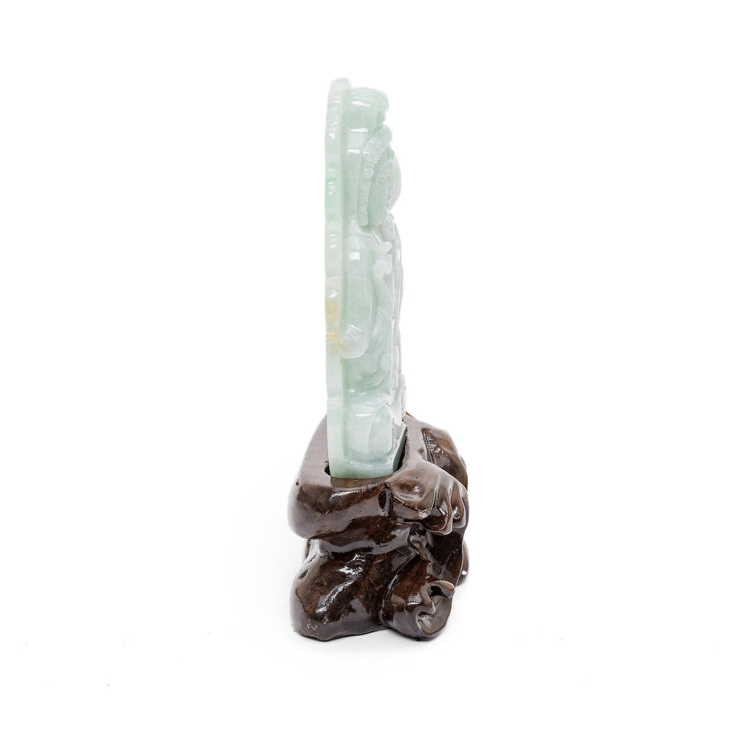 Compact jade sculpture with spiritual detail