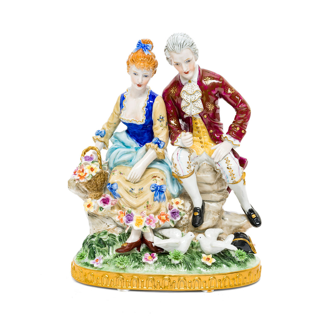 Courting Couple in Springtime German porcelain figurine featuring a romantic couple amidst flowers and doves.