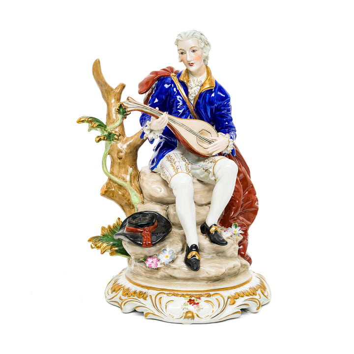 Courtyard Serenade German porcelain figurine of a young nobleman serenading with a lute.