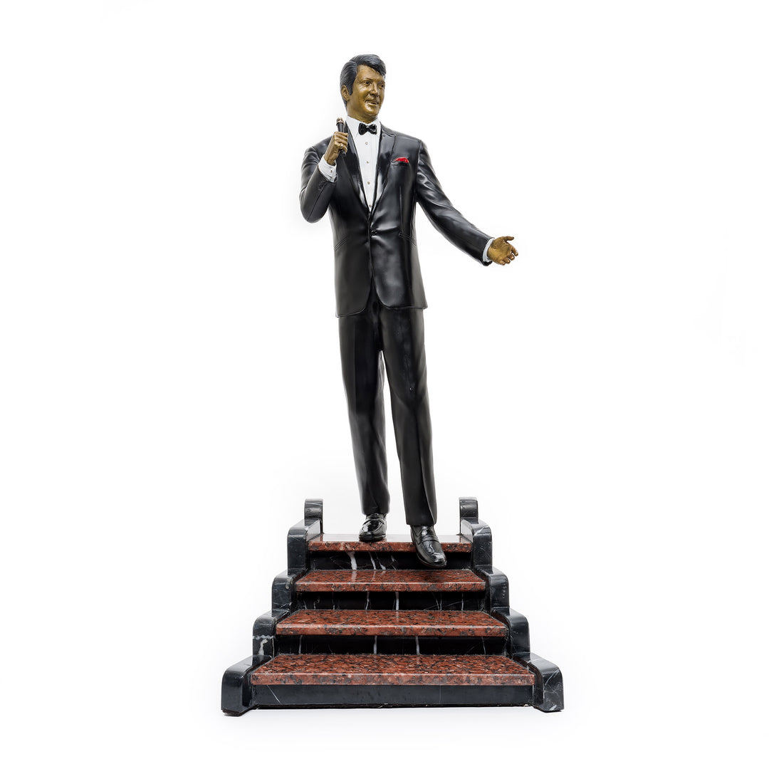 Dean Martin bronze sculpture standing on marble staircase